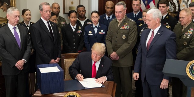 Trump signs defense